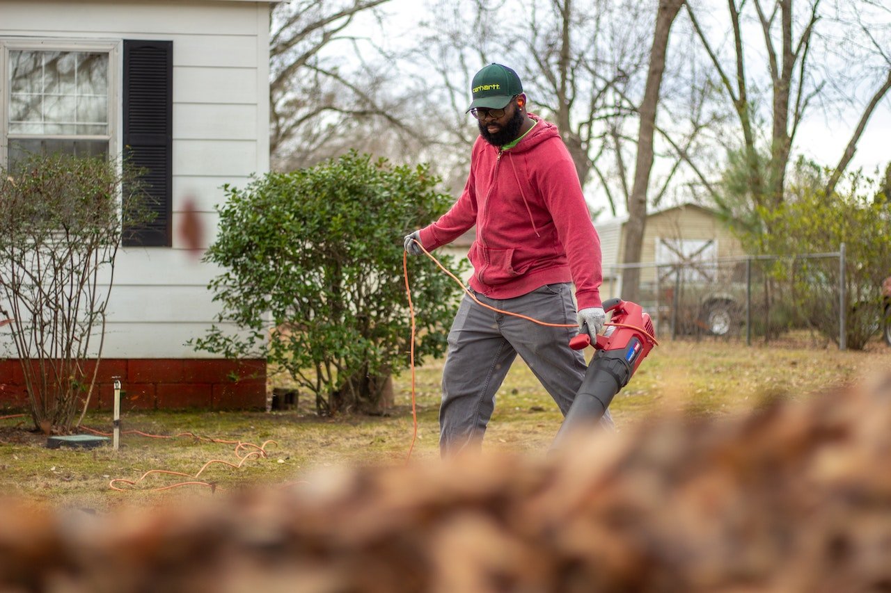 person using leaf blower